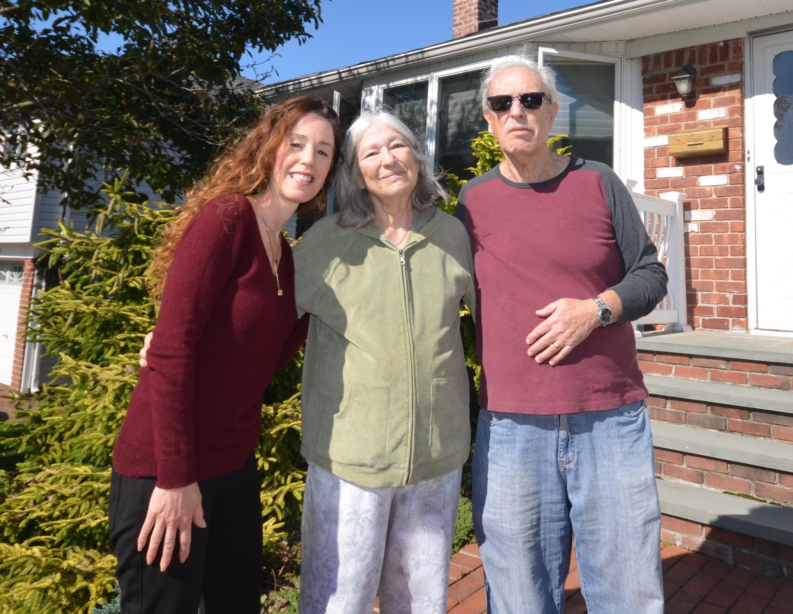 Happy retirees Dolores and Eddie Lubitch with their realtor Stacy Zigman who sold their Long Island home for well over asking in October 2021.